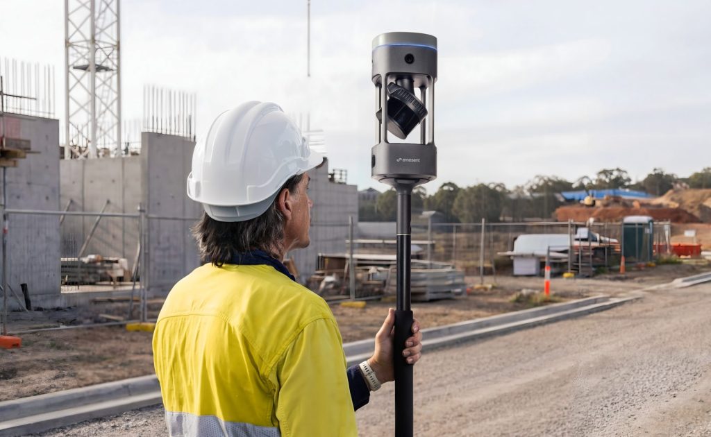 Emesent GX1 RTK SLAM scanner mounted on a pole