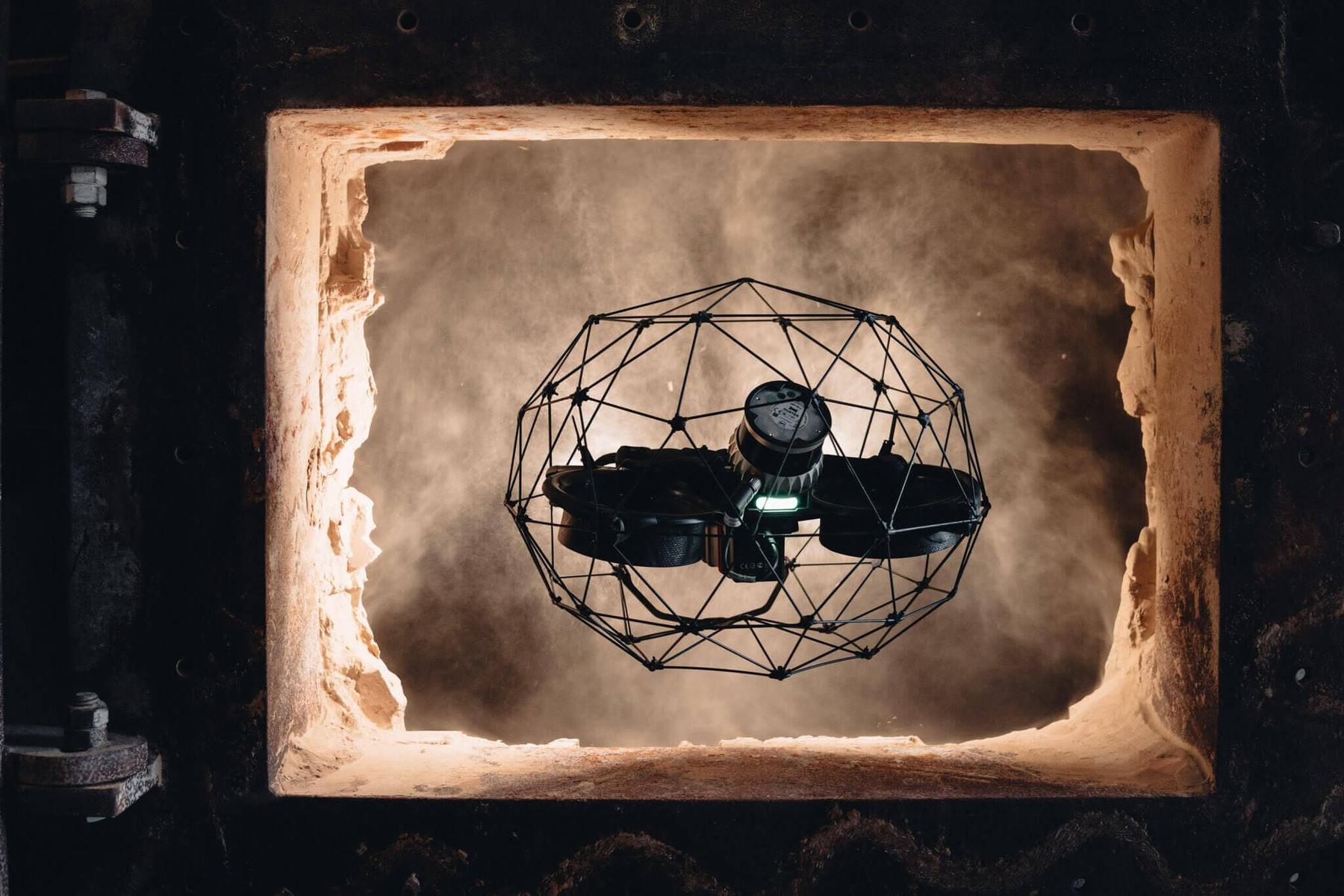 Elios 3 flying through a furnace access opening